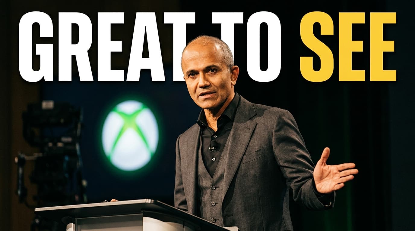 Satya Nadella speaking at a business conference with an Xbox logo backdrop